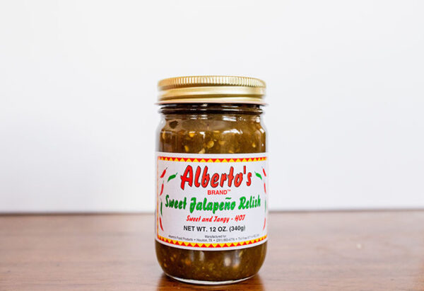 A jar of sweet jalapeno relish on top of a table.
