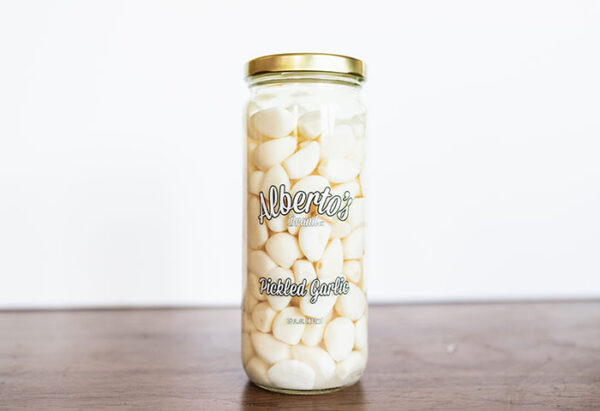 A jar of marshmallows on top of a table.