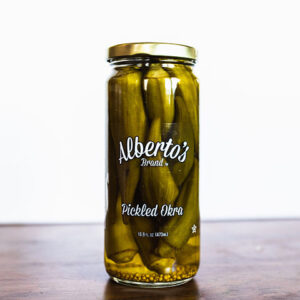 A jar of pickles sitting on top of a table.
